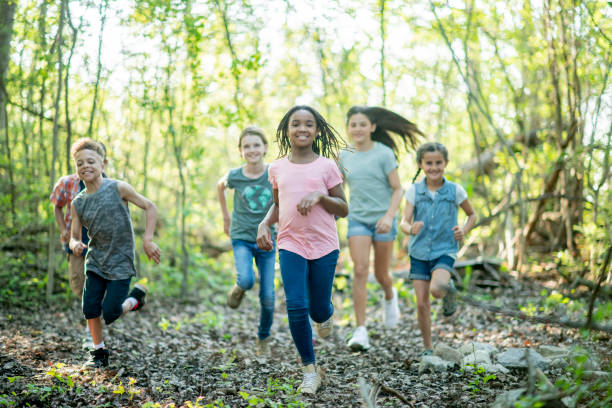 istock Kids in the woods 1034379106