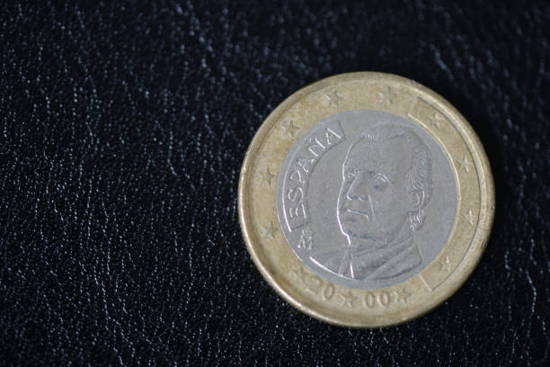 istock Coin in one euro on a dark background close up 1034382824