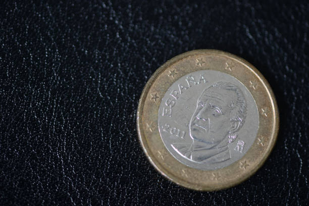 istock Coin in one euro on a dark background close up 1034382848