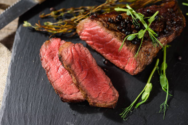 istock sliced rare steak black angus top view 1034391322