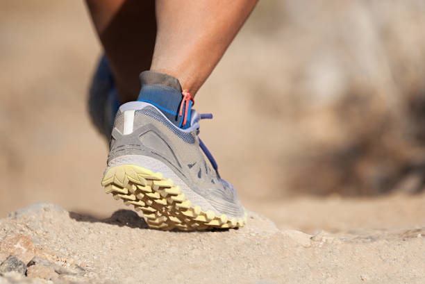 istock Athlete with athletic sneakers jogging or running nature 1034395406