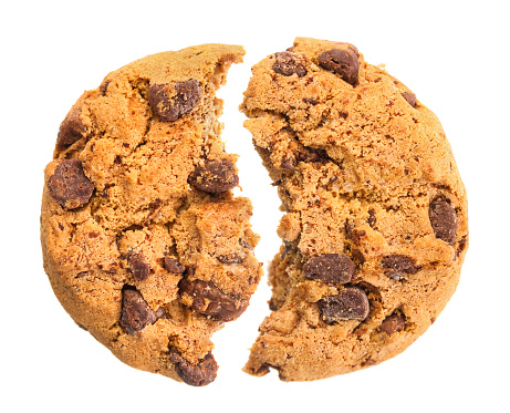 Broken chocolate cookie close up isolated on white background