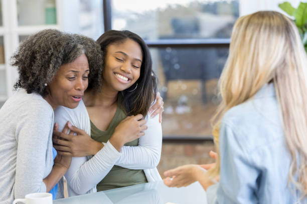istock Mother and daughter reconcile during therapy session 1034402102