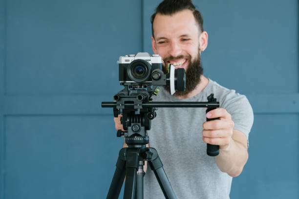 istock cameraman lifestyle man shoot video equipment 1034411578
