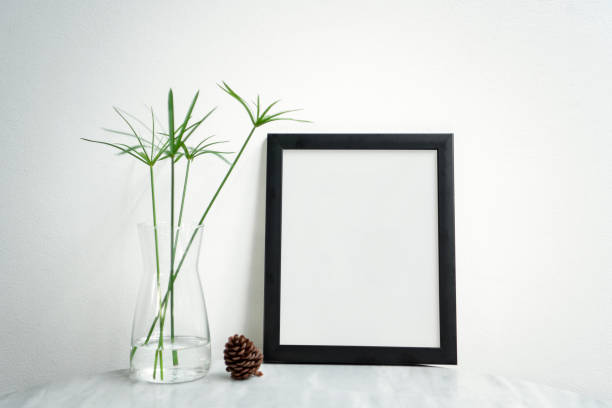 istock Blank Black Photo Frame and vase on table for Design Mockup Template. 1034413884
