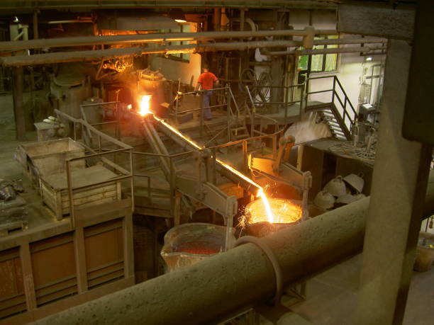 istock Metal flowing to conteiner in foundry 1034417440