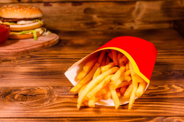 istock French fries and hamburger on wooden table 1034417950
