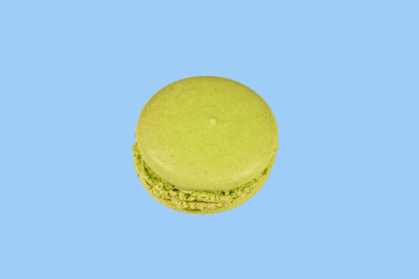 istock French macaroon isolated on the blue background 1034418052