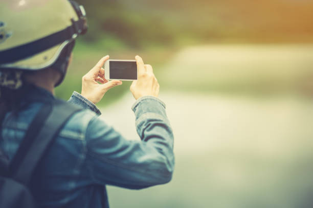 Tourist use smart phone taking photo beautiful nature
