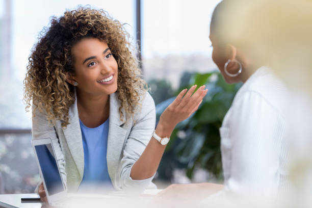 istock Young businesswoman talks with colleague 1034426844