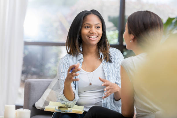 istock Encouraging counselor meets with female patient 1034426846