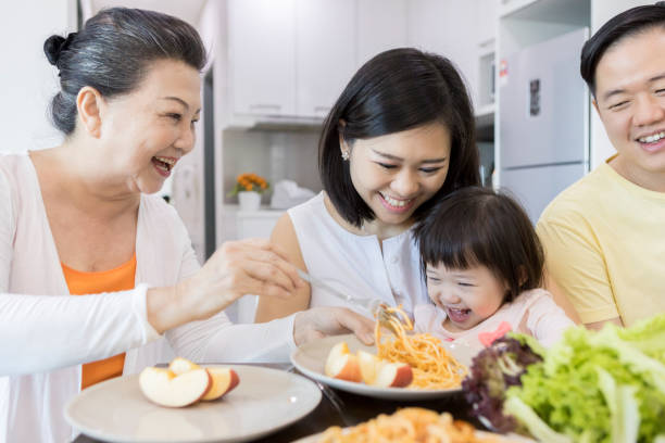 istock Multi-generational family eat meal together 1034426954