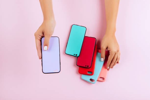 istock hands holding colorful smartphone cases 1034427470