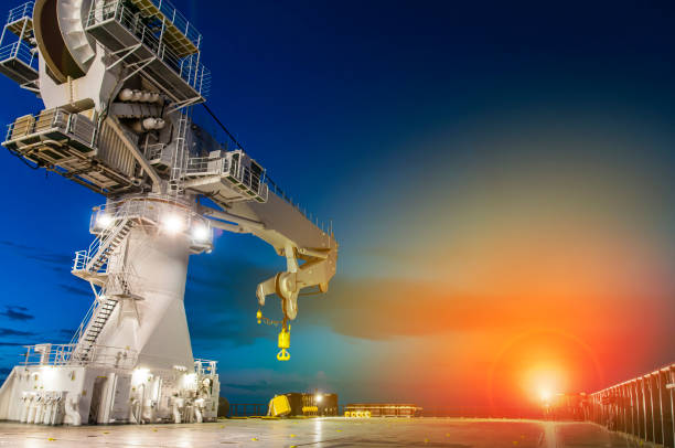 istock Offshore heavy lift crane at sea by night 1034431598