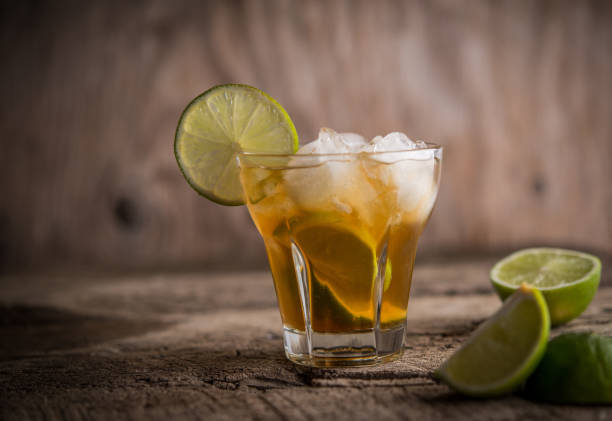 istock Refreshing ice drink with lime over wooden background 1034437950