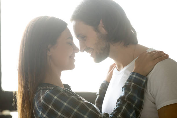 istock Passionate boyfriend admiring girlfriend hugging in bedroom 1034438950