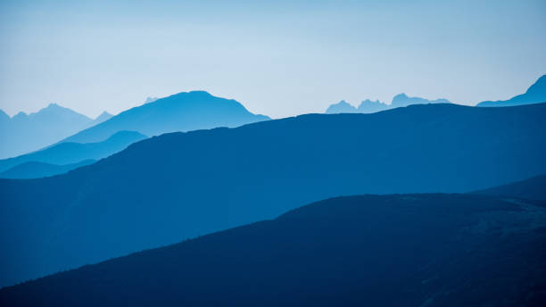istock mountain top panorama in  autumn covered in mist or clouds 1034441988