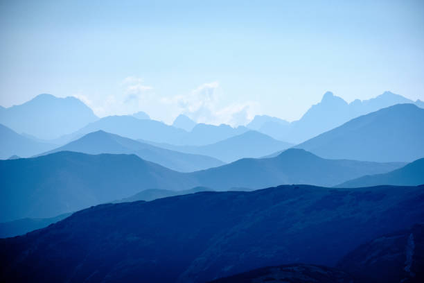 istock mountain top panorama in  autumn covered in mist or clouds 1034442116