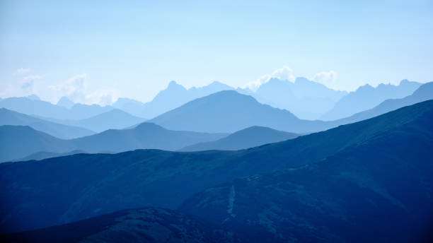 istock mountain top panorama in  autumn covered in mist or clouds 1034442150