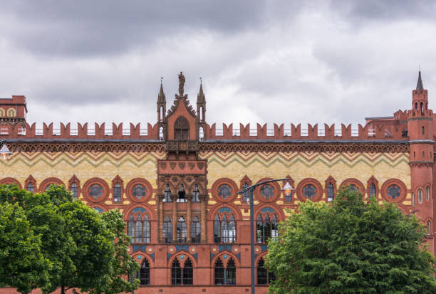Moody neogothic red brick church during bright sunset. The Cathedral of the Immaculate Conception of the Holy Virgin Mary in Moscow, Russia.