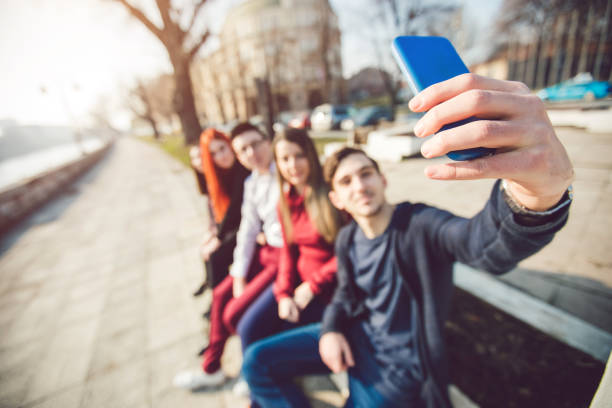 istock Friends making selfie by the river 1034442694