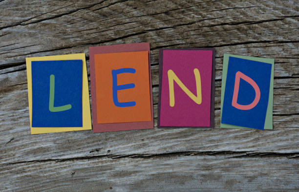 istock Lend word written on colorful sticky notes on wooden background. 1034447614