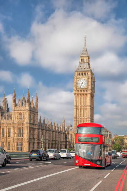 istock Big Ben with red bus in London, England, UK 1034447826