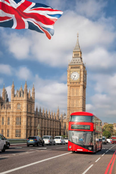 istock Big Ben with red bus in London, England, UK 1034447984