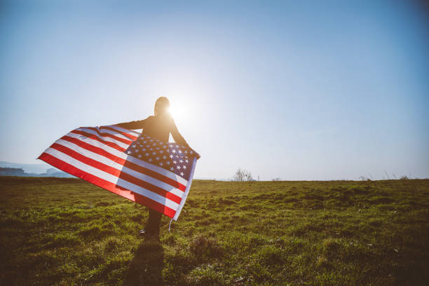 Woman waving USA flag