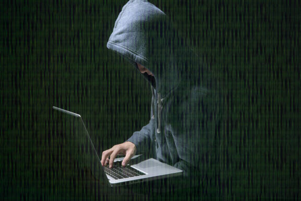 istock hacker in darkness the access to steal information and infect computers and systems. concept of hacking and cyber attack. 1034448924
