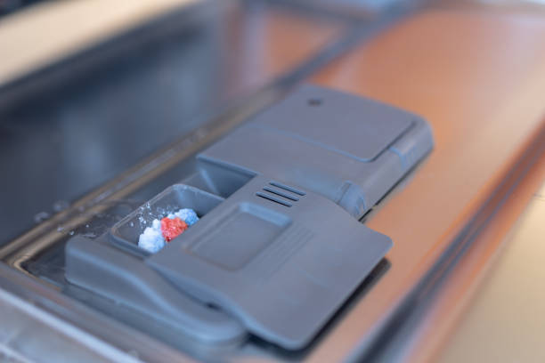 istock Place for a powder or tablet in a kitchen dishwasher. Kitchen appliances helpful in home-made households. 1034451414