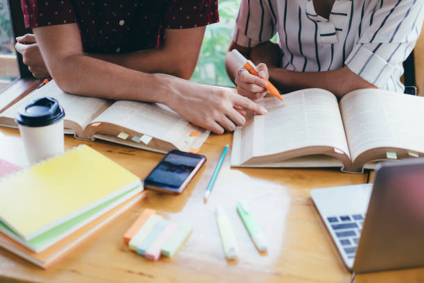 istock Young students campus helps friend catching up and learning 1034453716