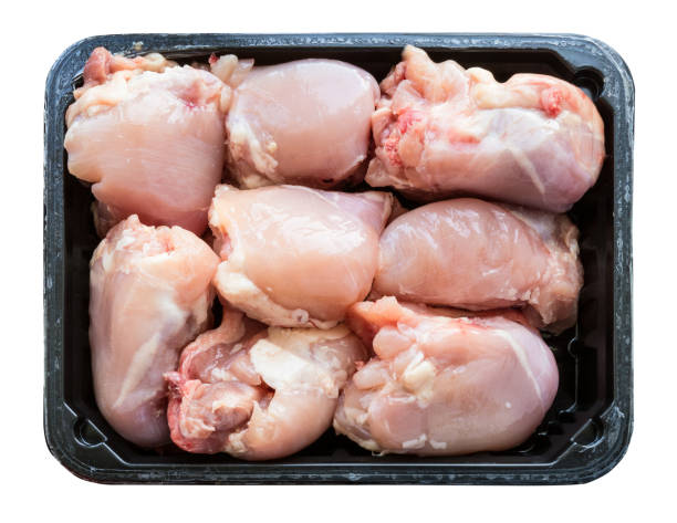 istock pieces of raw chicken meat on plastic tray 1034454374