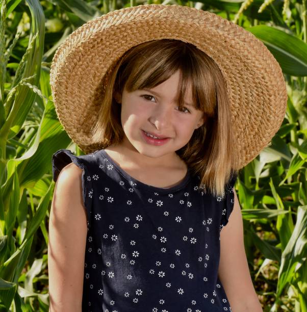 istock Young Girl in a Cornfield 1034454800