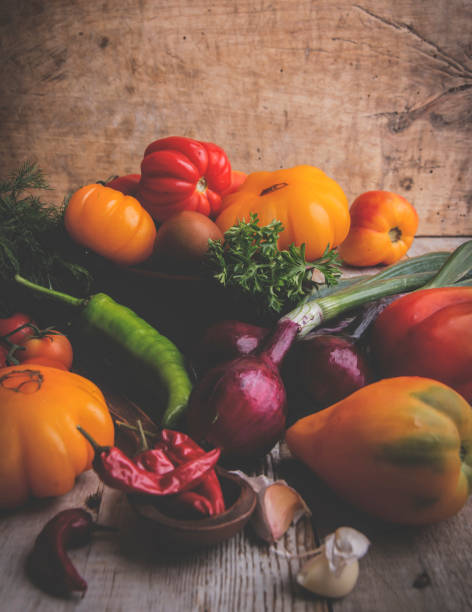 istock different kinds of tomato, vegetables, onion, pepper, garlic still life,rustic 1034458324