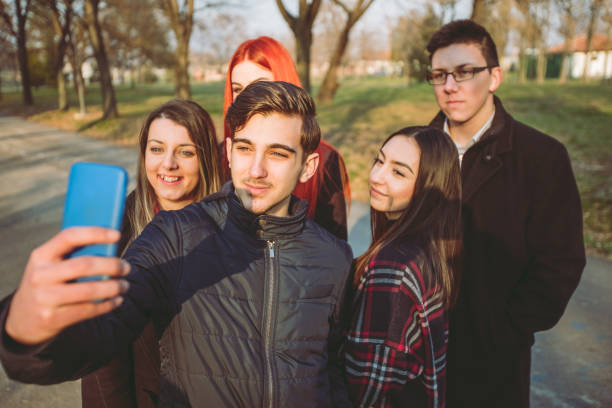 istock Friends making selfie in a park 1034461300