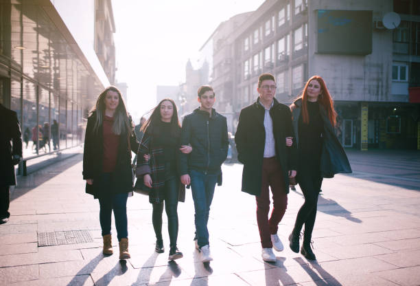 istock Five friends walking down the street 1034461958