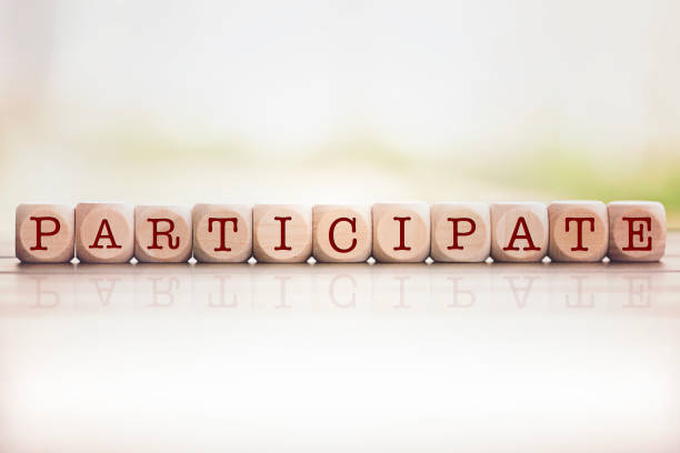 istock Participate written on cube wooden blocks. 1034464438