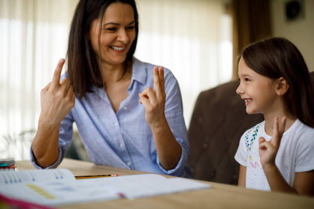 istock Mother helping daughter with homework 1034464914