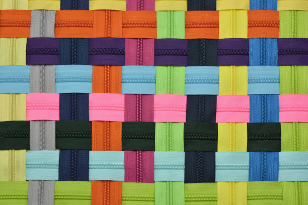 istock Abstract background of intertwined zipper-lock 1034464994