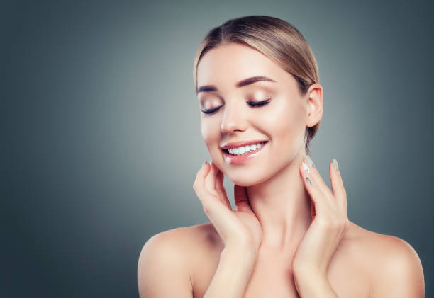 istock Healthy young woman smiling on background with copy space 1034468812
