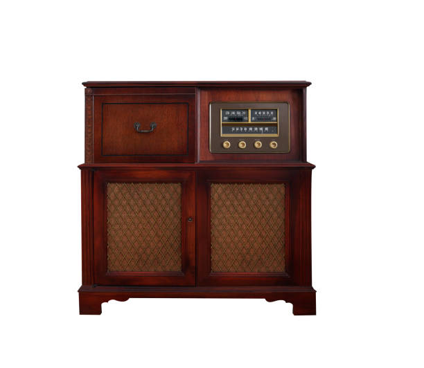 Retro styled image of old radio's in front of a retro wallpaper with flower pattern