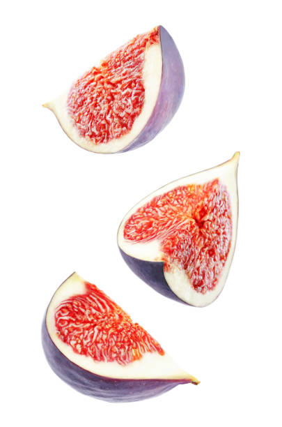 Fresh flying Figs fruits Fresh flying Figs fruits on a white background. toning. selective focus fig photos stock pictures, royalty-free photos & images