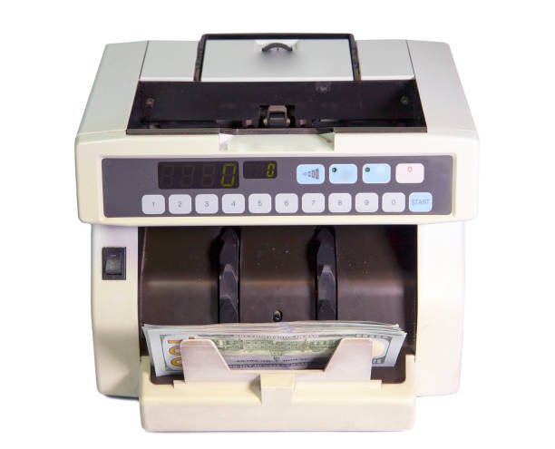 istock electronic money counter machine with American dollars 1034479744