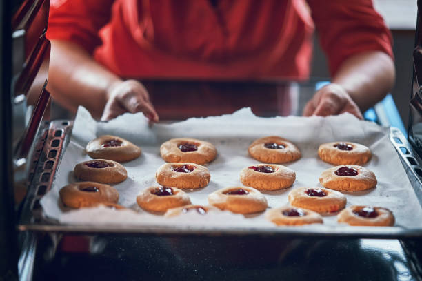 istock Preparing Peanut Butter Cookies with Marmalade in Domestic Kitchen 1034484086