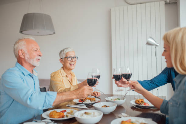 istock Family drinking wine over lunch 1034485090