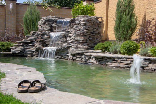 istock fountain with two overflows, in antique style. Using natural materials such as wild marble, slate, granite and basalt 1034485166