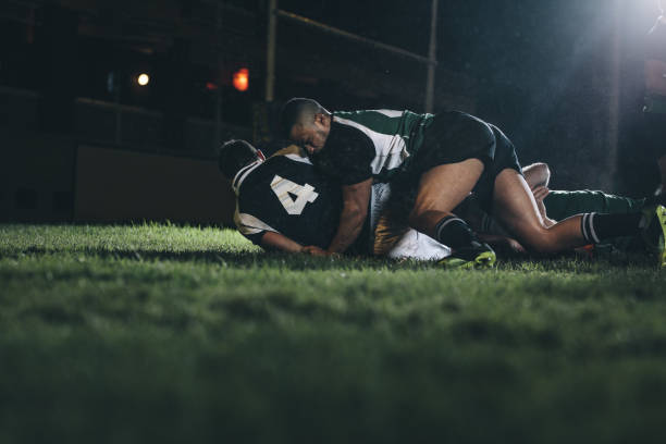 istock Rugby players fight for the ball 1034486856