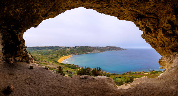 istock Tal-Mixta Cave, above Ramla Bay Beach (Red Sandy Beach), Gozo, Malta 1034487692