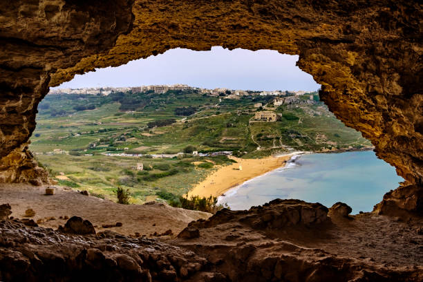 istock Tal-Mixta Cave, above Ramla Bay Beach (Red Sandy Beach), Gozo, Malta 1034487966